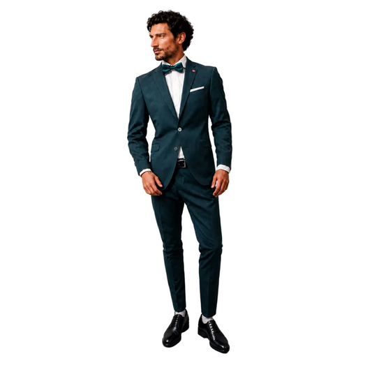 A man standing against a blank white background modeling a Digel men's 2-piece ceremony suit in emerald teal green. The formal outfit features a tailored single-breasted two-button blazer with a pocket square, matching slim flat-front dress trousers, a white shirt, a shiny dark teal bow tie, and polished black leather dress shoes.