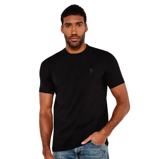 Man wearing a black Karl Lagerfeld t-shirt on a white background