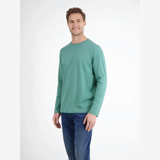 Man wearing an ice green Lerros basic long sleeve shirt with blue jeans, front view studio photo, available at Kayagan