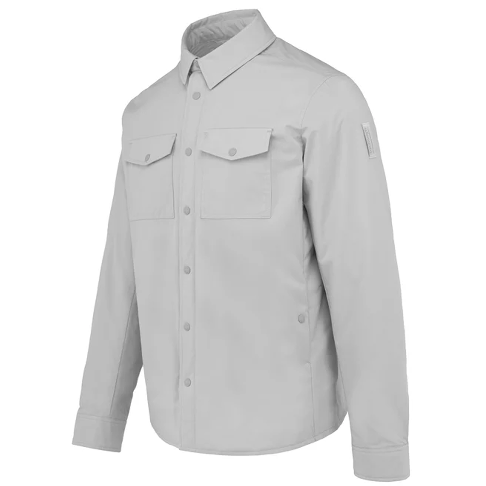 A flat-lay studio product shot of a Bomboogie men's technical fabric overshirt in a clean light grey shade, centered on a white background. The shirt jacket features a classic pointed collar, a snap-button front closure, two matching rectangular flap chest pockets, and buttoned long-sleeve cuffs.