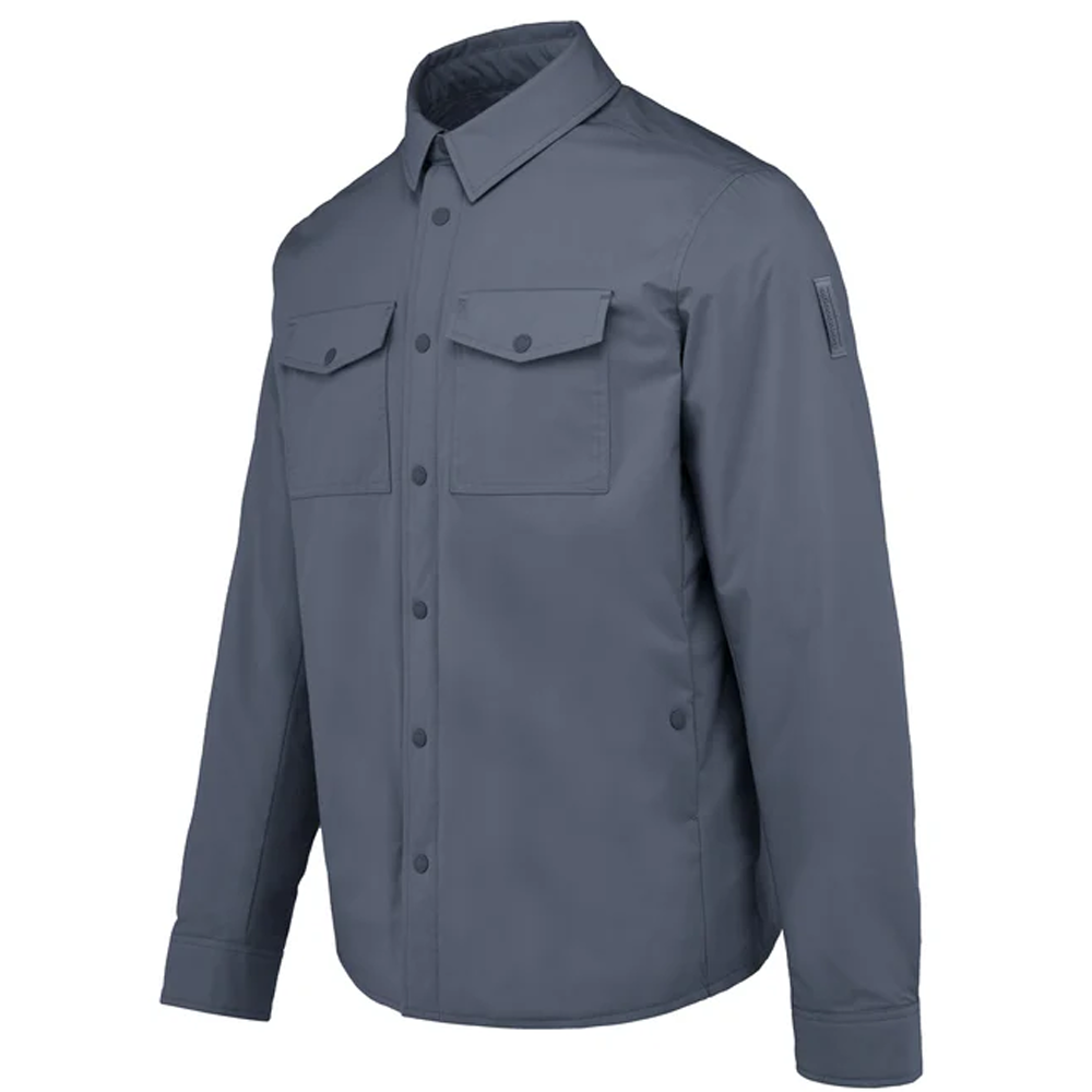 A flat-lay studio product shot of a Bomboogie men's technical fabric overshirt in a clean navy shade, centered on a white background. The shirt jacket features a classic pointed collar, a snap-button front closure, two matching rectangular flap chest pockets, and buttoned long-sleeve cuffs.