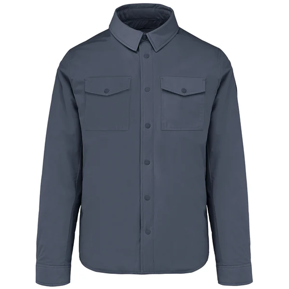 A flat-lay studio product shot of a Bomboogie men's technical fabric overshirt in a clean navy shade, centered on a white background. The shirt jacket features a classic pointed collar, a snap-button front closure, two matching rectangular flap chest pockets, and buttoned long-sleeve cuffs.