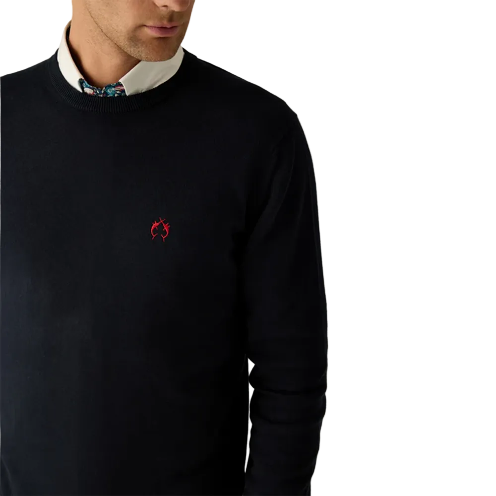Man wearing Campione navy crewneck sweater layered over a shirt, styled with denim jeans, Kayagan, Lebanon