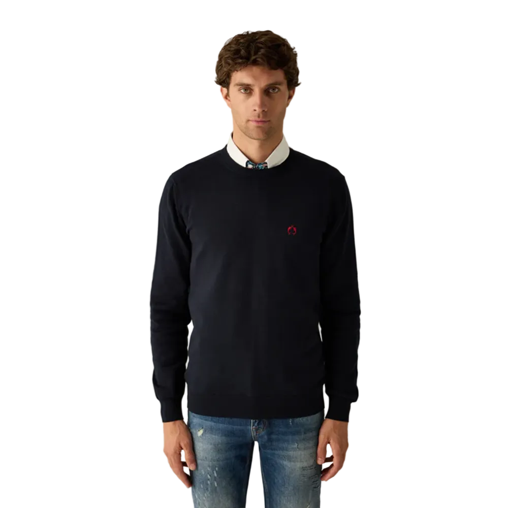 Man wearing Campione navy crewneck sweater layered over a shirt, styled with denim jeans, Kayagan, Lebanon