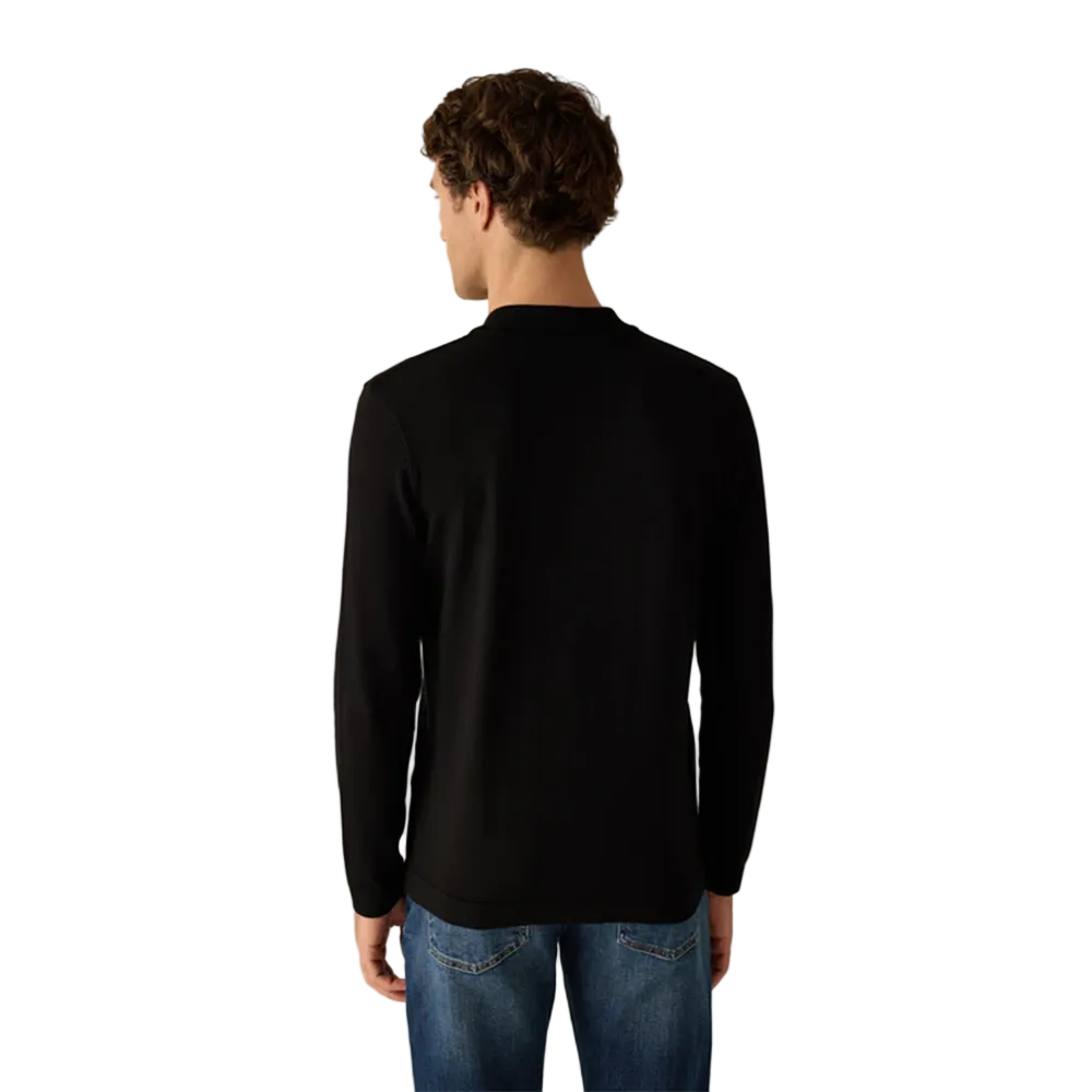 Man wearing Campione black long-sleeved polo shirt with ribbed collar, and an embroidered Campione logo on the chest, Kayagan, Lebanon