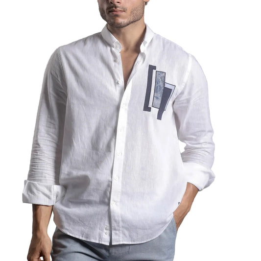 Man wearing Campione white linen shirt with geometric patch detail on chest, rolled-up sleeves, Kayagan.