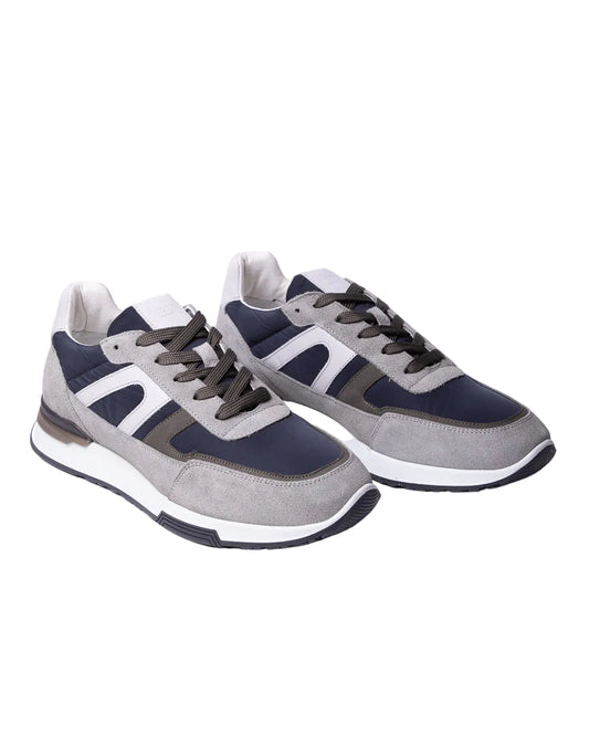 A pair of Digel men's retro running sneakers made from a mix of navy blue nylon and light grey suede panels, displayed on a clean white background. The trainers feature a color-blocked low-top design, dark grey flat laces, a thick white midsole, and a black textured rubber outsole.