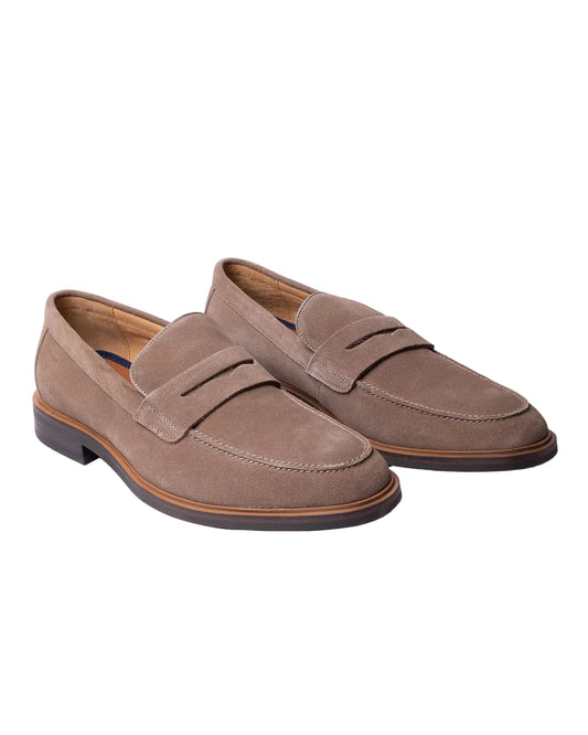 A pair of Digel men's penny loafers made from premium taupe suede leather, viewed from a three-quarter angle on a white background. The shoes feature a classic apron toe, a traditional strap accent, a leather lining, and a dark low heel sole with a tan welt.