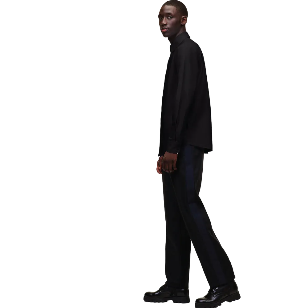 A front view of a model wearing a crisp black long-sleeve Karl Lagerfeld Ikon Poplin Shirt with a button-down collar and small embroidered chest logo.