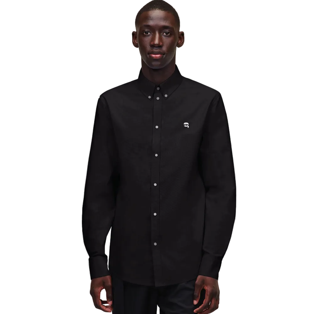 A front view of a model wearing a crisp black long-sleeve Karl Lagerfeld Ikon Poplin Shirt with a button-down collar and small embroidered chest logo.
