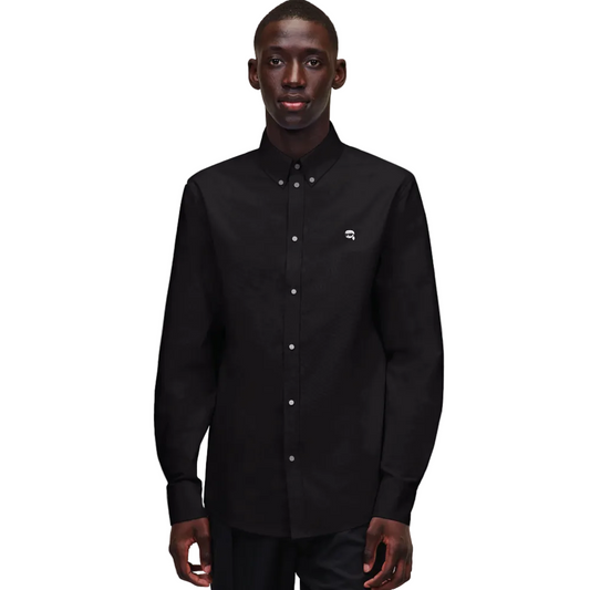 A front view of a model wearing a crisp black long-sleeve Karl Lagerfeld Ikon Poplin Shirt with a button-down collar and small embroidered chest logo.