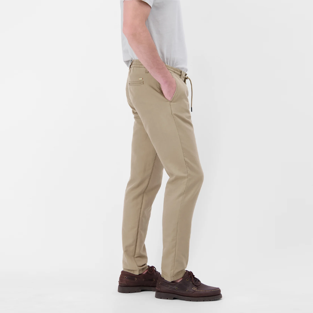 Man wearing beige Lerros lightweight chinos with drawstring waist and pleated front, front view studio photo, available at Kayagan