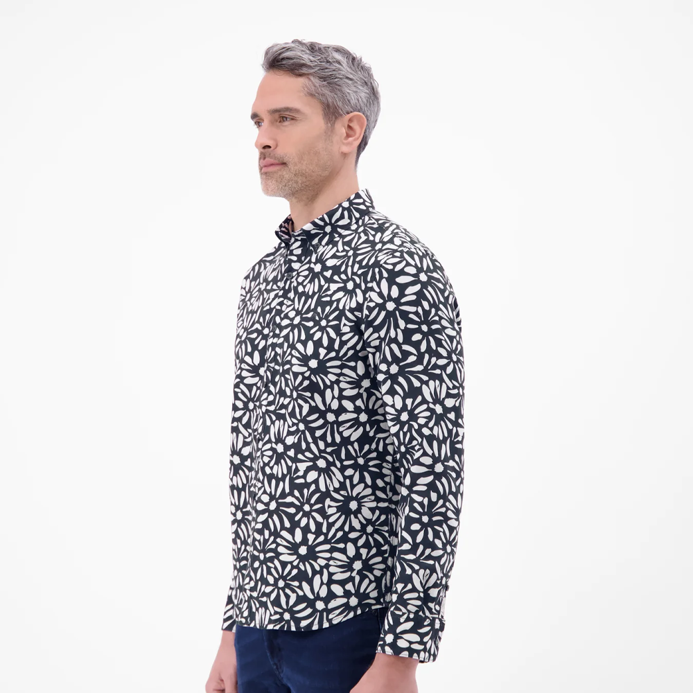 Man wearing a black and white floral print Lerros long-sleeved shirt with navy jeans, front view studio photo, available at Kayagan