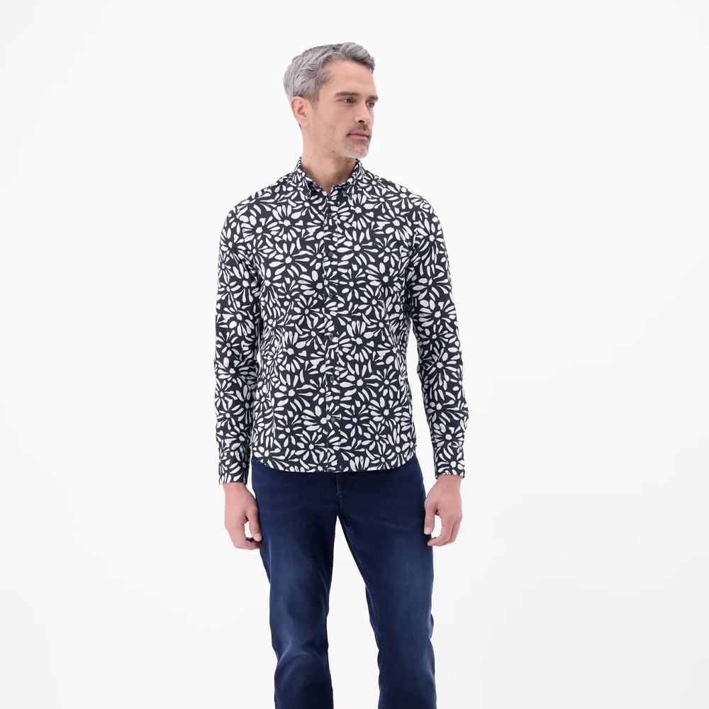 Man wearing a black and white floral print Lerros long-sleeved shirt with navy jeans, front view studio photo, available at Kayagan