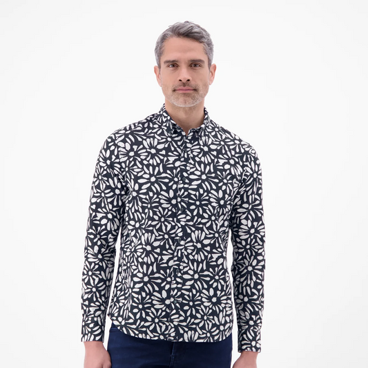 Man wearing a black and white floral print Lerros long-sleeved shirt with navy jeans, front view studio photo, available at Kayagan