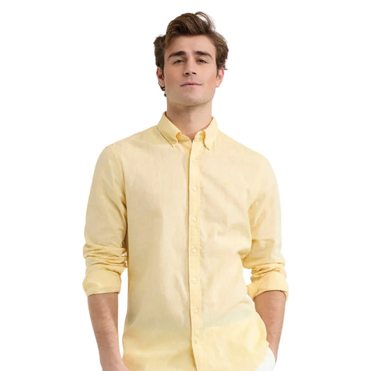 Close-up of a model wearing a McGregor men's lemon  yellow linen cotton button-up shirt with a button-down collar.