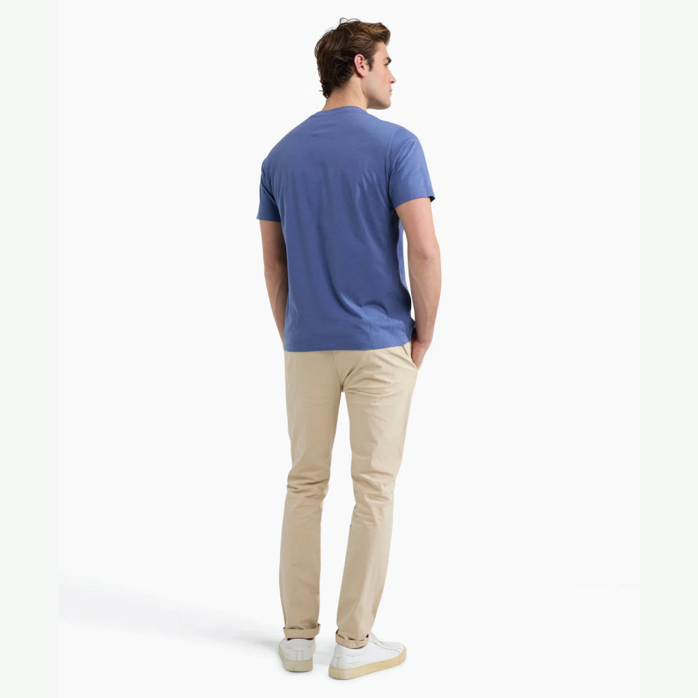 Model wearing a McGregor men's blue Original Print crew neck T-shirt with a vintage logo graphic and short sleeves on a white background.