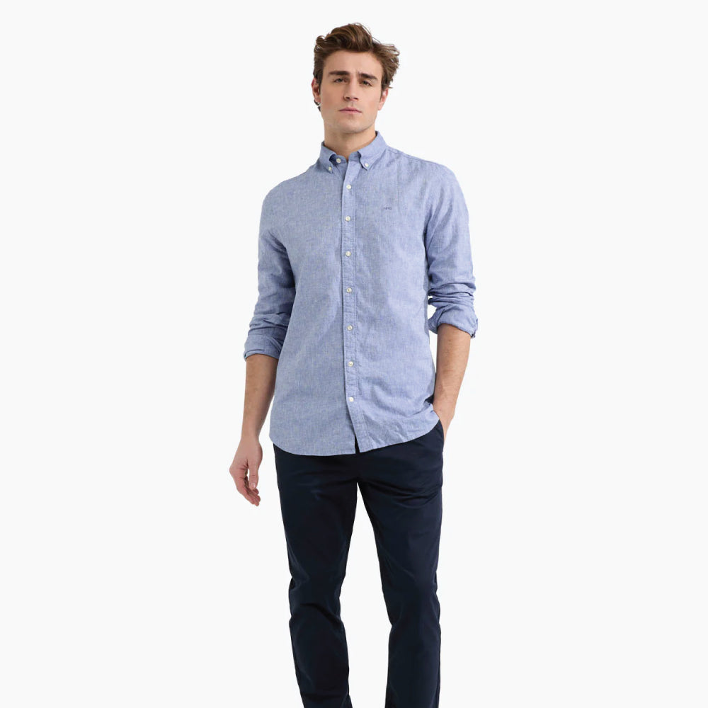 Model wearing a McGregor men's blue linen cotton button-down shirt with long sleeves and a classic collar on a white background.