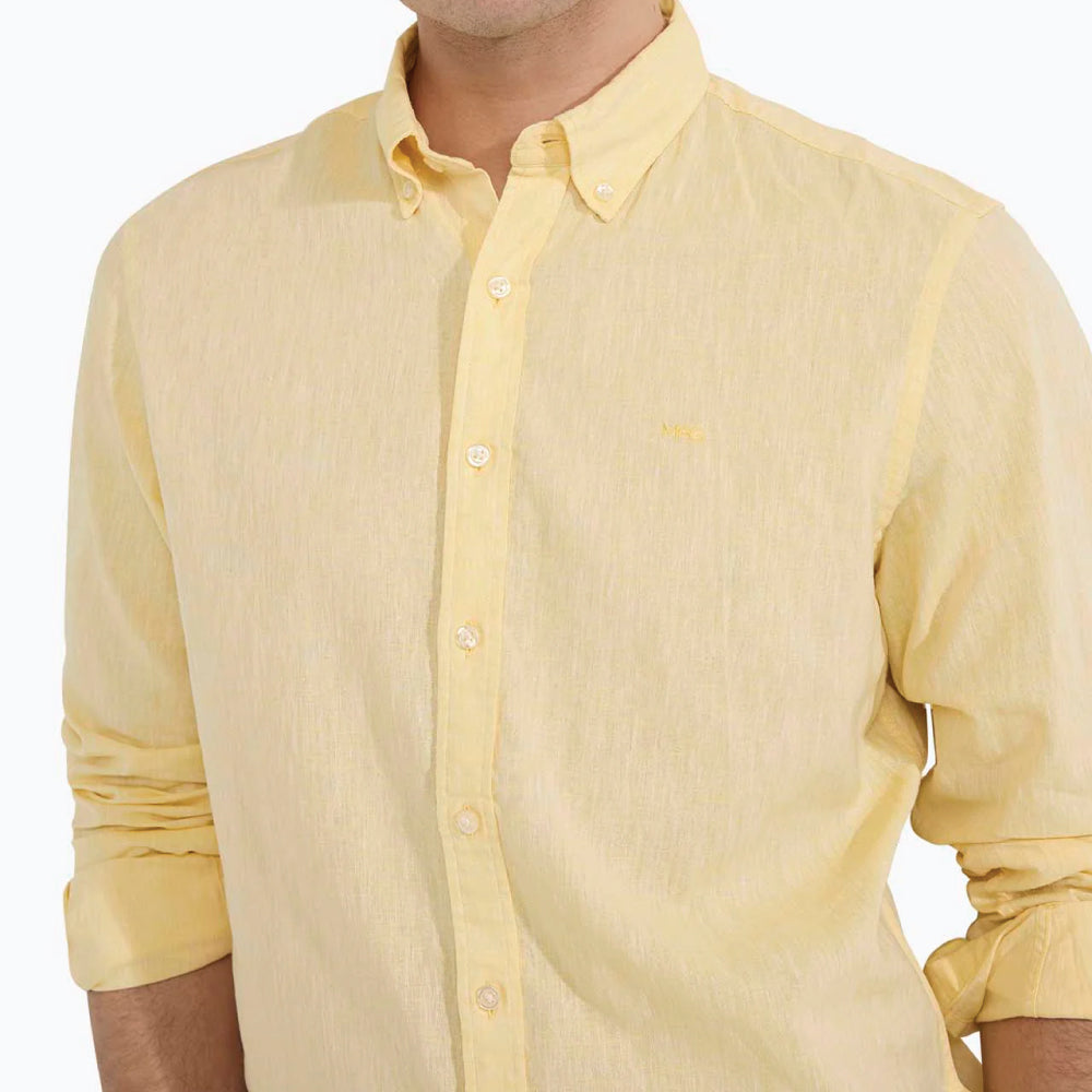 Close-up of a model wearing a McGregor men's lemon  yellow linen cotton button-up shirt with a button-down collar.