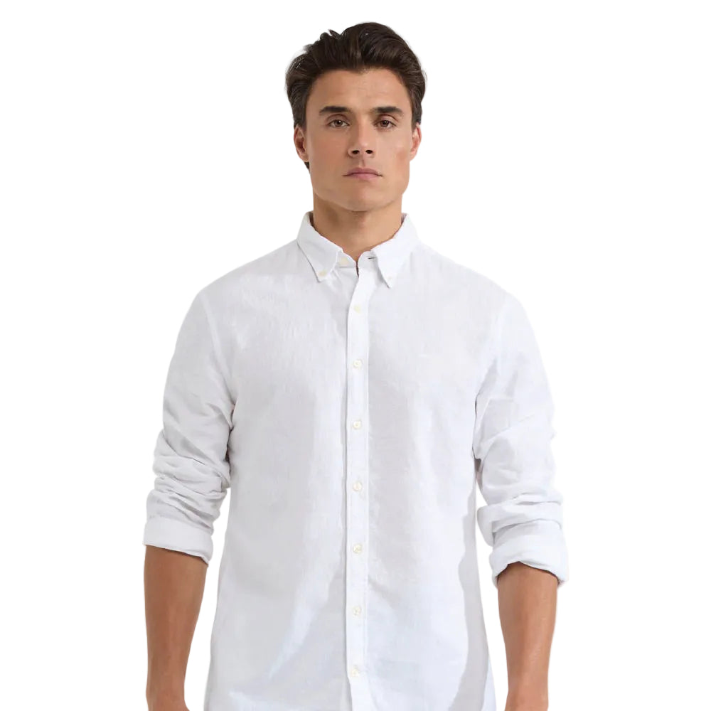 Man wearing a white McGregor button-up shirt 