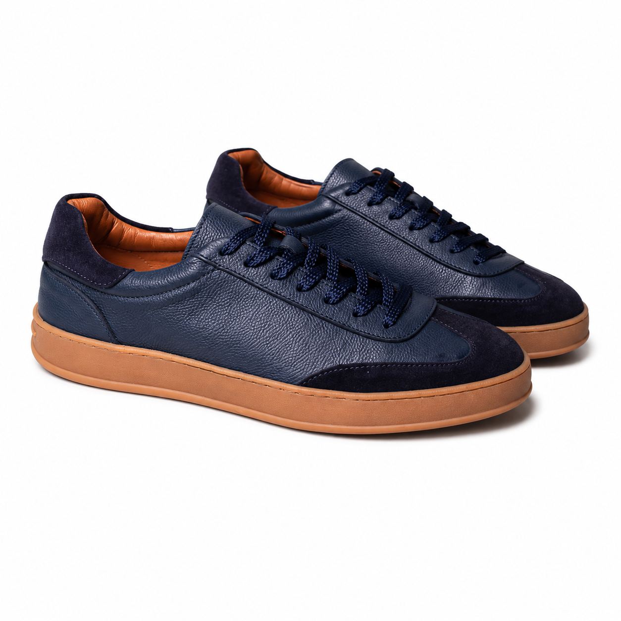 Pair of Pedro navy blue sneakers with brown soles 
