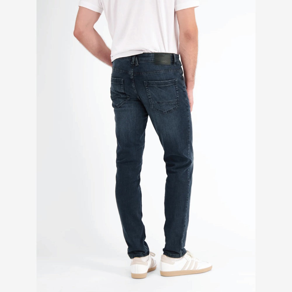 Man wearing Lerros Conlin dark blue comfort stretch denim jeans, slim fit, front view studio photo, available at Kayagan