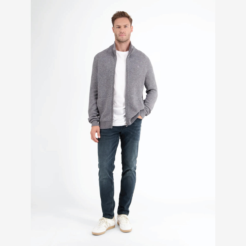 Man wearing Lerros Conlin dark blue comfort stretch denim jeans, slim fit, styled with a grey zip cardigan, front view studio photo, available at Kayagan