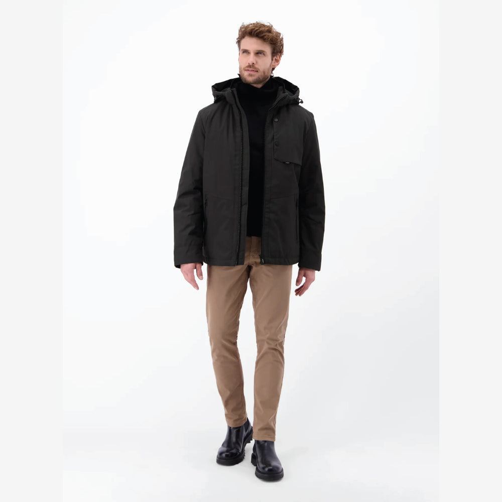 Man wearing a black Lerros structured blouson jacket with hood, styled with beige chinos, front view studio photo, at Kayagan