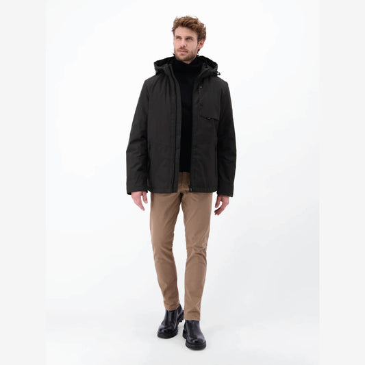 Man wearing a black Lerros structured blouson jacket with hood, styled with beige chinos, front view studio photo, at Kayagan
