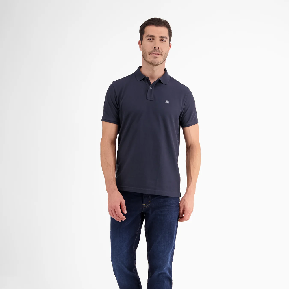 Man wearing a navy Lerros classic polo shirt in Cool and Dry piqué fabric, front view studio photo
