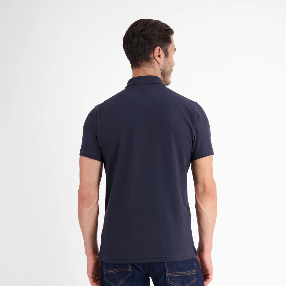 Man wearing a navy Lerros classic polo shirt in Cool and Dry piqué fabric, front view studio photo
