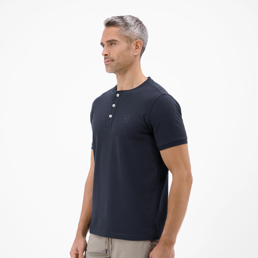 Man wearing a navy Lerros t-shirt with round collar, button placket, and Cool and Dry fabric, front view studio photo, available at ayagan