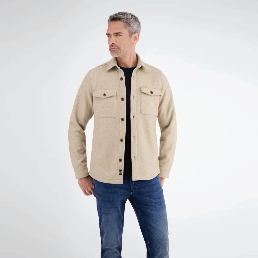Man wearing a beige Lerros urban-style shirt jacket in wool look with chest pockets, styled with denim jeans, front view studio photo, available at Kayagan