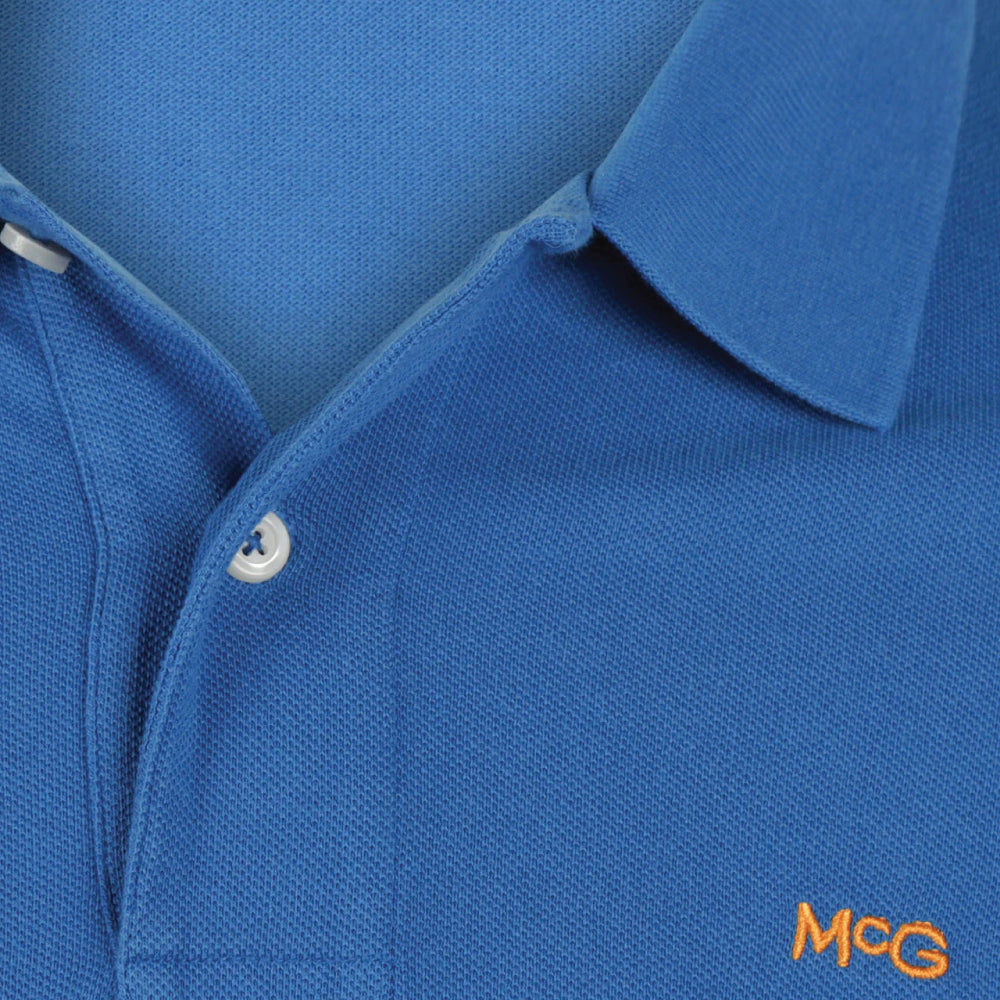 Front view of a McGregor men's classic regular fit blue polo shirt with a two-button placket and embroidered logo.