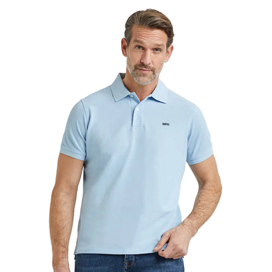 Model wearing a McGregor men's classic regular fit baby blue polo shirt with a ribbed collar and short sleeves on a white background.