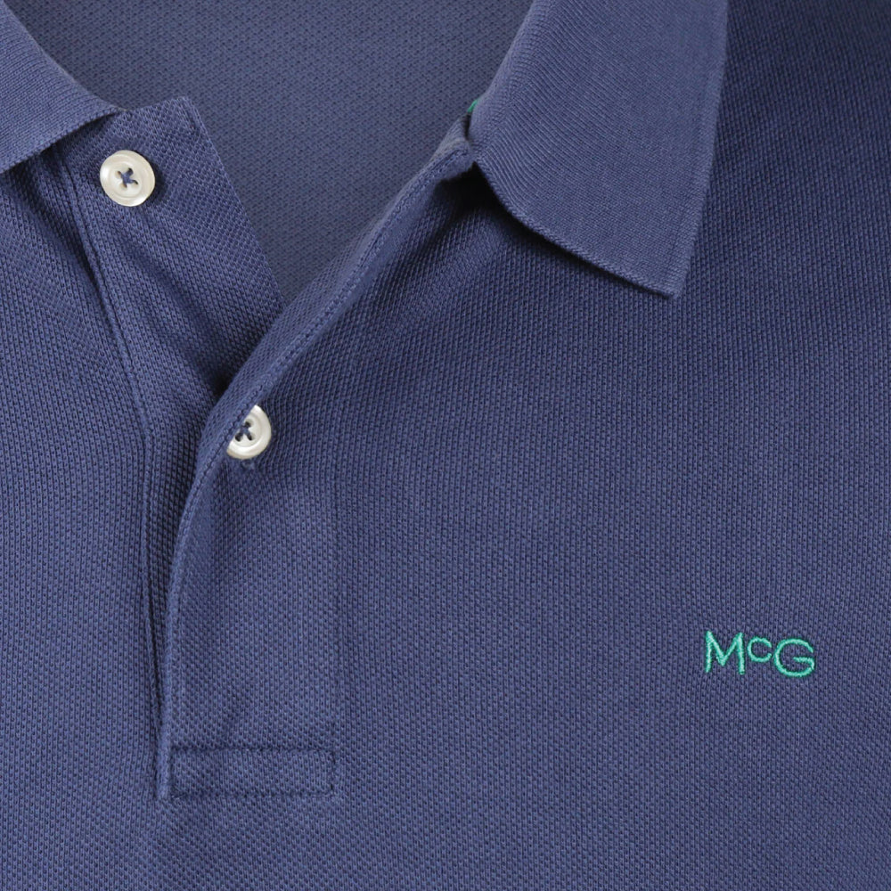 McGregor men's classic regular fit navy blue polo shirt with a ribbed collar and short sleeves on a white background.