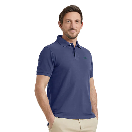 Model wearing a McGregor men's classic regular fit navy blue polo shirt with a ribbed collar and short sleeves on a white background.