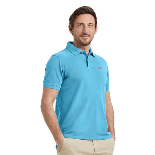 Man wearing a McGregor men's classic regular fit Sea blue polo shirt with a ribbed collar and short sleeves on a white background.