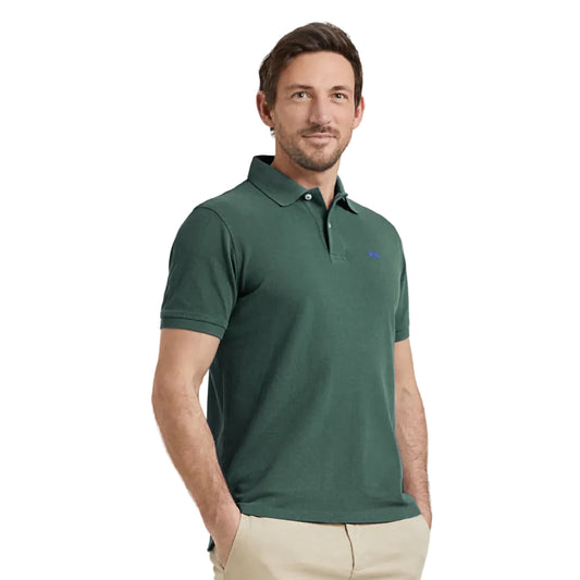 Model wearing a McGregor men's classic regular fit dark green polo shirt with a ribbed collar and short sleeves on a white background.