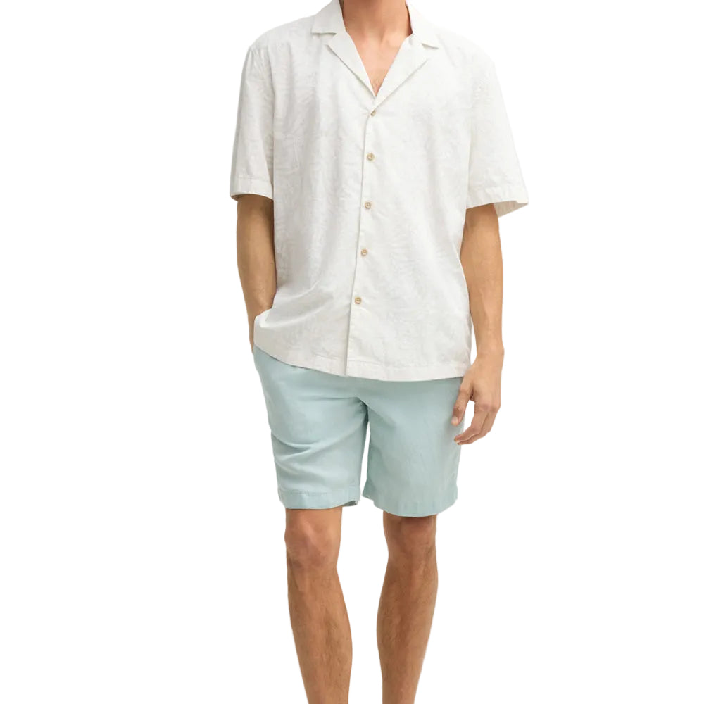 Man wearing Strellson Cliro ecru short-sleeved shirt with tonal palm leaf pattern and camp collar