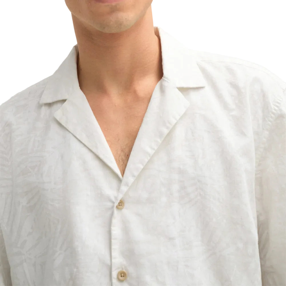 Man wearing Strellson Cliro ecru short-sleeved shirt with tonal palm leaf pattern and camp collar