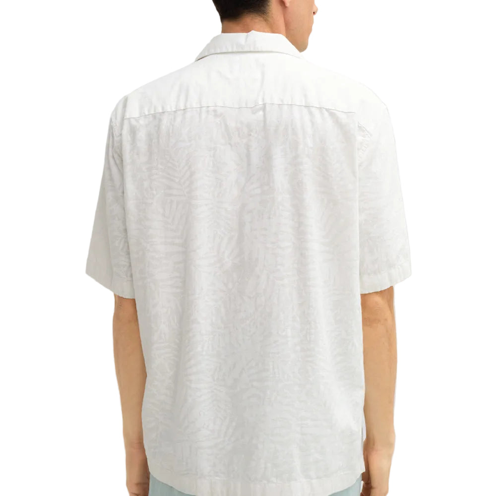 Man wearing Strellson Cliro ecru short-sleeved shirt with tonal palm leaf pattern and camp collar