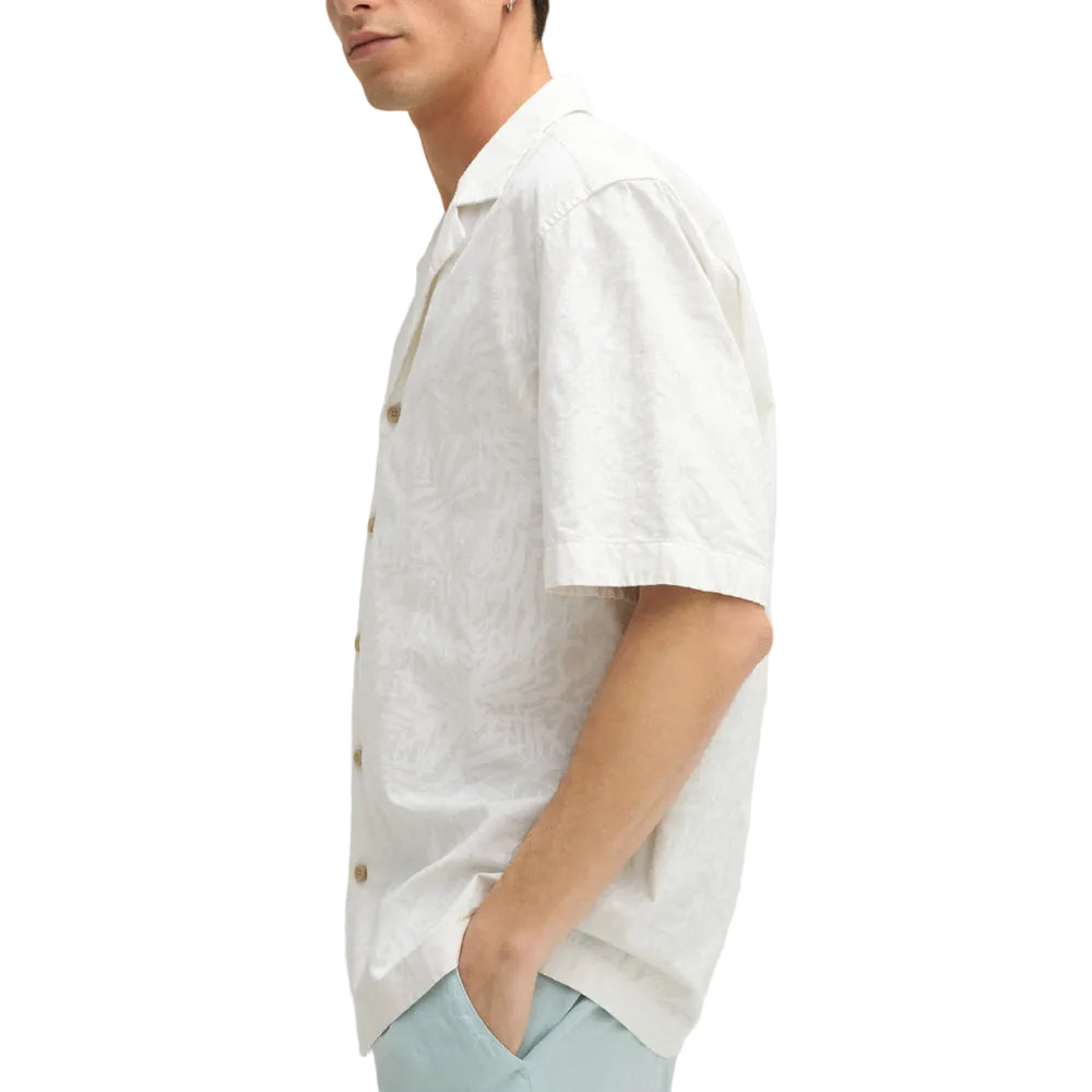Man wearing Strellson Cliro ecru short-sleeved shirt with tonal palm leaf pattern and camp collar