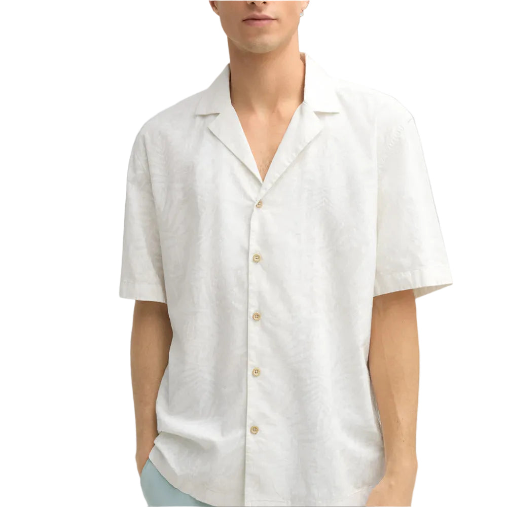 Man wearing Strellson Cliro ecru short-sleeved shirt with tonal palm leaf pattern and camp collar