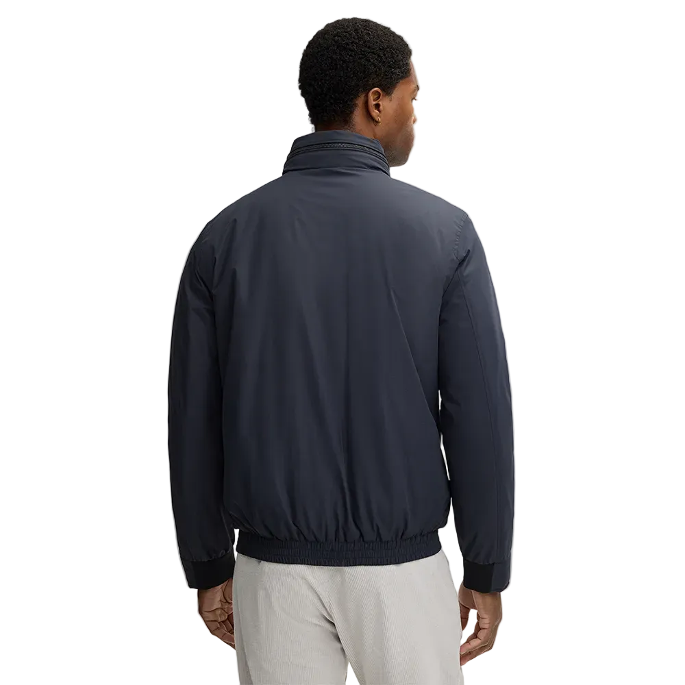 Man wearing Strellson dark blue light jacket with stand collar and front zip closure