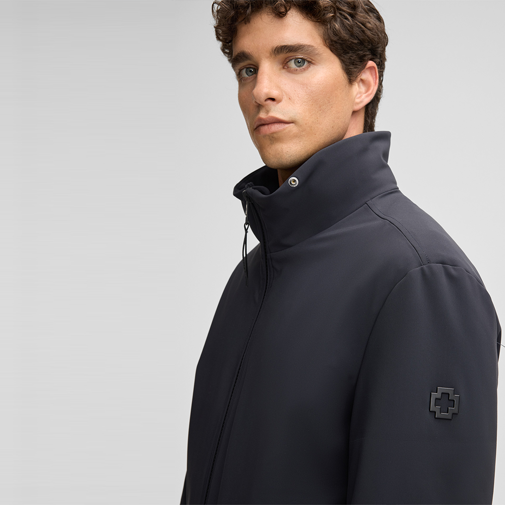 Man wearing Strellson Lucca navy water-repellent jacket with faux-fur lined hood