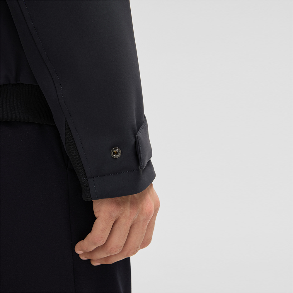 Man wearing Strellson Lucca navy water-repellent jacket with faux-fur lined hood