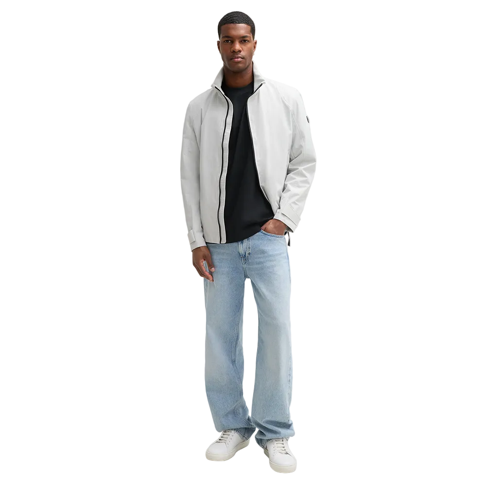 Man wearing Strellson Lucca Windbreaker Jacket in off-white with stand collar and zip front, and embroidered logo on the left arm, Kayagan