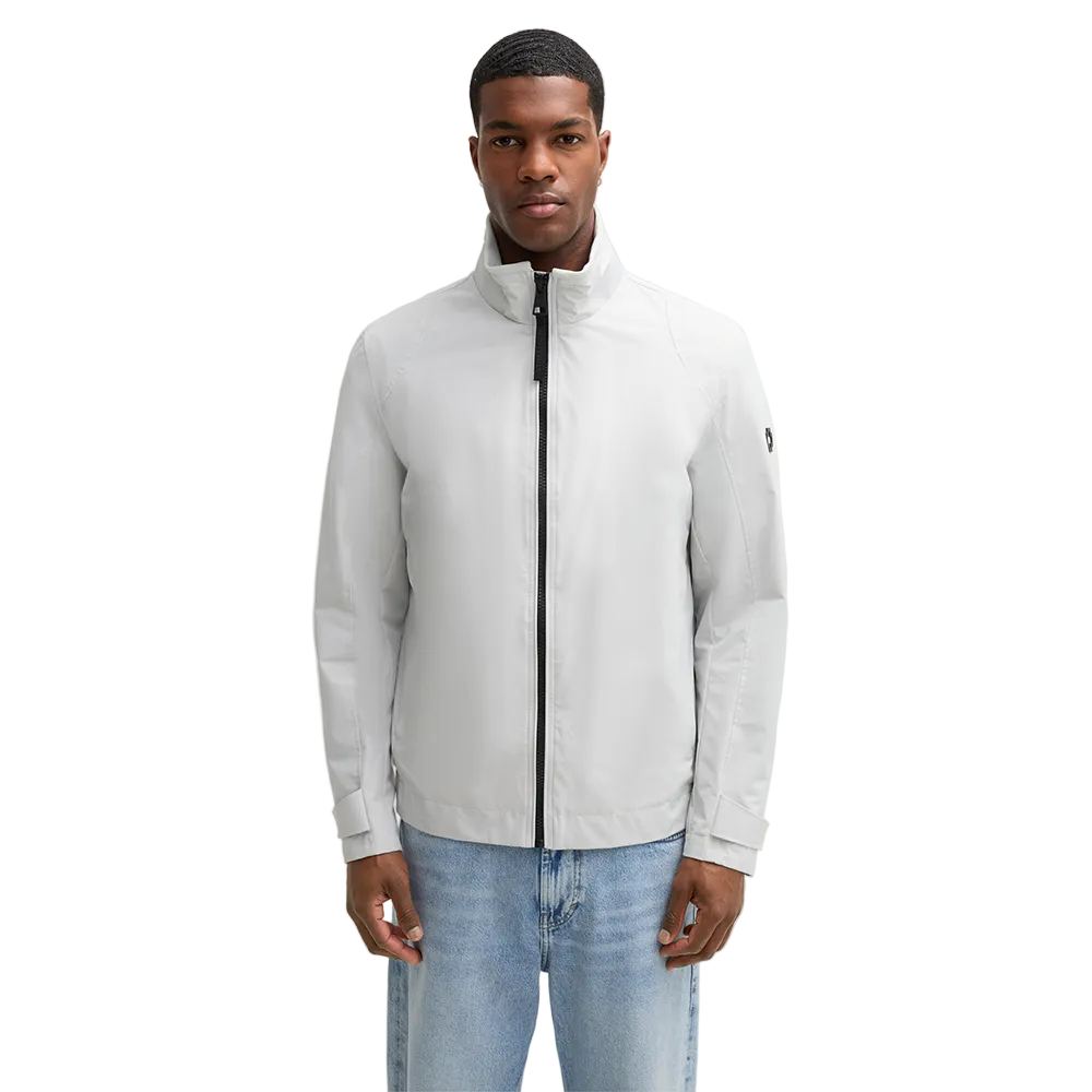 Man wearing Strellson Lucca Windbreaker Jacket in off-white with stand collar and zip front, and embroidered logo on the left arm, Kayagan