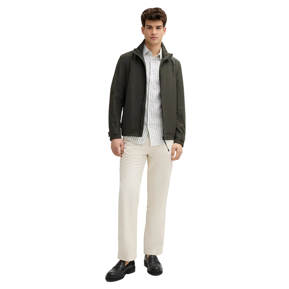 Man wearing Strellson Lucca Windbreaker Jacket in olive with stand collar and zip front, and embroidered logo on the left arm, Kayagan